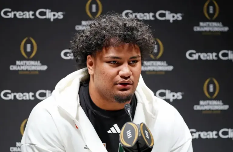 Miami Hurricanes offensive lineman Francis Mauigoa (61)talks to the media during media day for the 2025 College Football Playoff National Championship