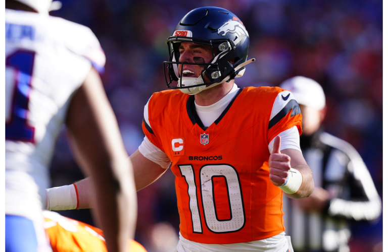 Broncos QB Bo Nix calls an audible during the first quarter of an AFC Divisional Round playoff game against the Buffalo Bills