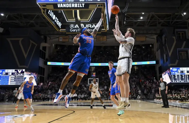 Florida player goes for a block on Vandy player.