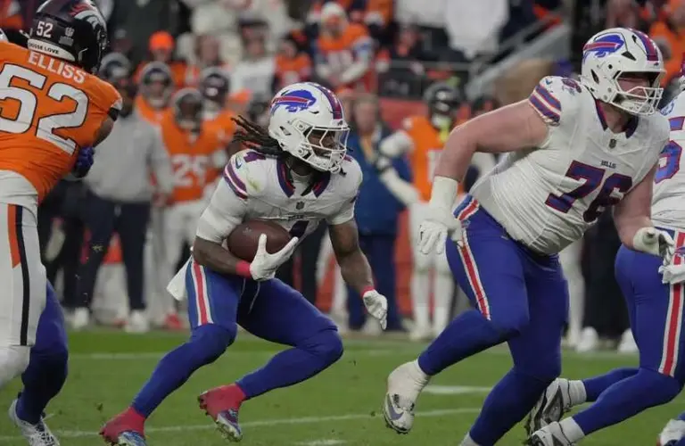 Bills player looks to rush ball.
