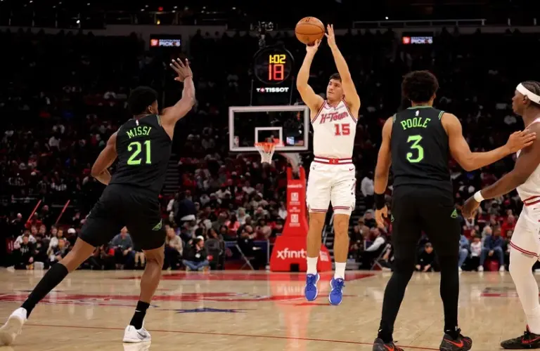 Houston Rockets guard Reed Sheppard (15) shoots against New Orleans Pelicans center Yves Missi (21) during the first quarter at Toyota Center.