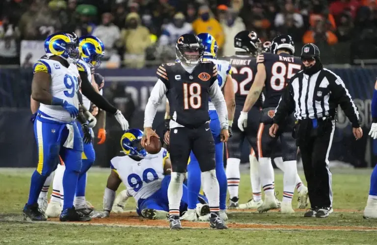 Chicago Bears quarterback Caleb Williams (18) looks on against the Los Angeles Rams during overtime of an NFC Divisional Round game at Soldier Field