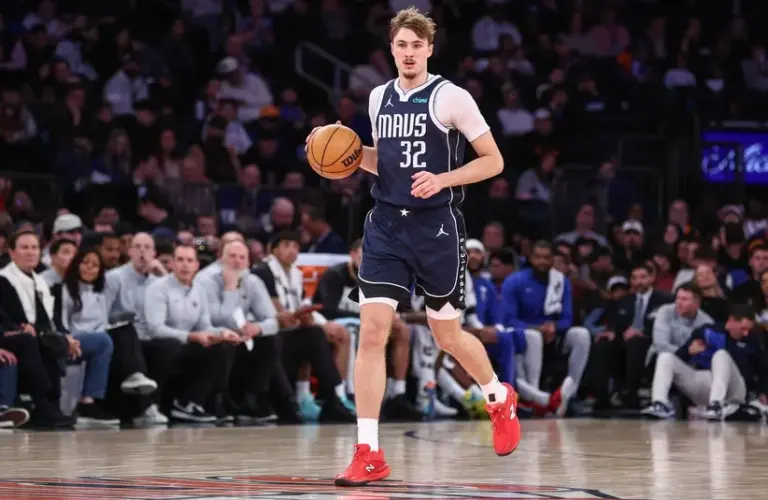 Dallas Mavericks forward Cooper Flagg (32) brings the ball upcourt against the New York Knicks