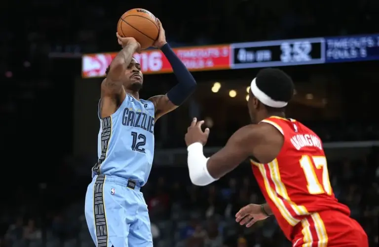 Memphis Grizzlies guard Ja Morant (12) shoots during the fourth quarter against the Atlanta Hawks at FedExForum.