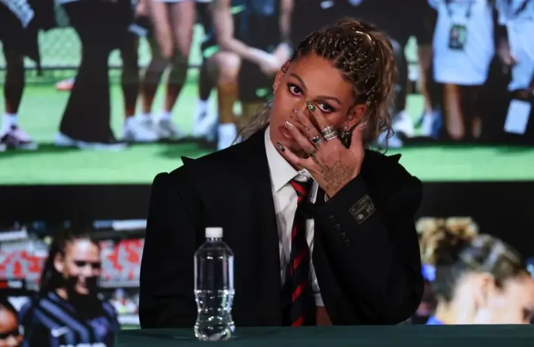 Trinity Rodman of the Washington Spirit wipes a tear during a press conference at BMO Stadium