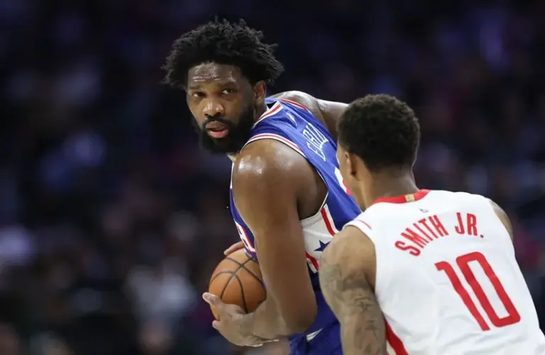 Philadelphia 76ers center Joel Embiid (21) controls the ball against Houston Rockets forward Jabari Smith Jr. (10) during the second quarter at Xfinity Mobile Arena