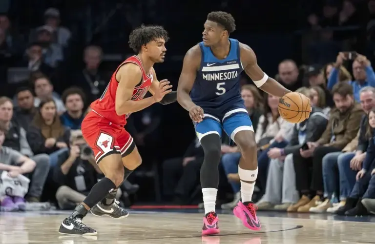 ; Minnesota Timberwolves guard Anthony Edwards (5) dribbles the ball as Chicago Bulls guard Tre Jones (30) defends in the second half at Target Center