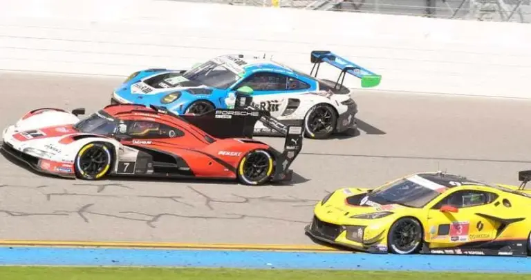 Cars race on the banking during the latter stages of the Rolex 24, Sunday, Jan. 25, 2026 at Daytona International Speedway.