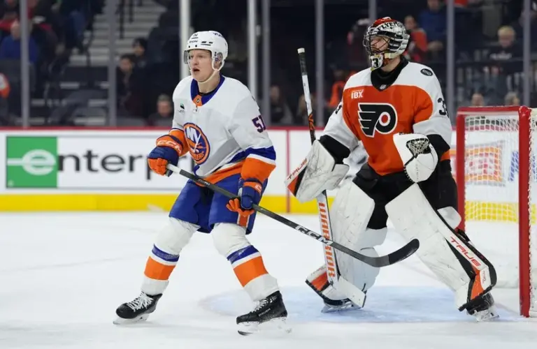 New York Islanders left wing Emil Heineman (51) battles for position against Philadelphia Flyers goalie Samuel Ersson (33) in the second period at Xfinity Mobile Arena.