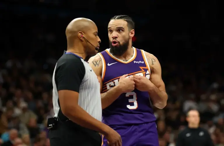 Phoenix Suns forward Dillon Brooks (3) talks to a referee against the Brooklyn Nets in the second half at Mortgage Matchup Center