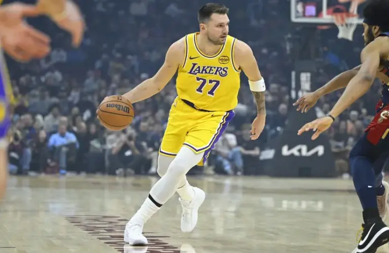 Los Angeles Lakers guard Luka Doncic (77) dribbles the ball in the first quarter against the Cleveland Cavaliers at Rocket Arena