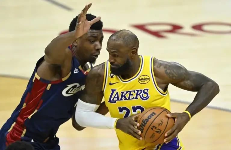 Cleveland Cavaliers center Thomas Bryant (3) defends Los Angeles Lakers forward LeBron James (23) in the fourth quarter at Rocket Arena