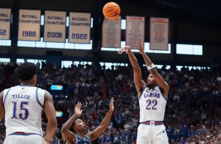 Kansas Jayhawks guard Darryn Peterson (22) fires a three point shot against BYU Cougars during the game.