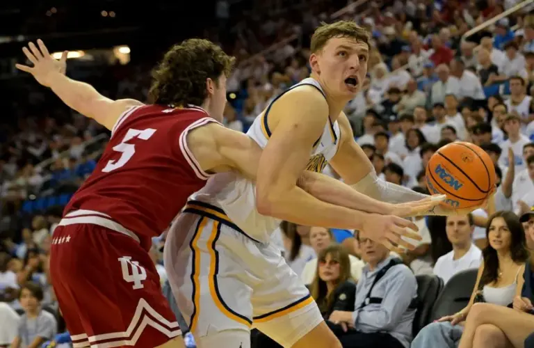 UCLA Bruins forward Tyler Bilodeau (34) is fouled by Indiana Hoosiers guard Conor Enright (5) in the first half at Pauley Pavilion presented by Wescom Financial