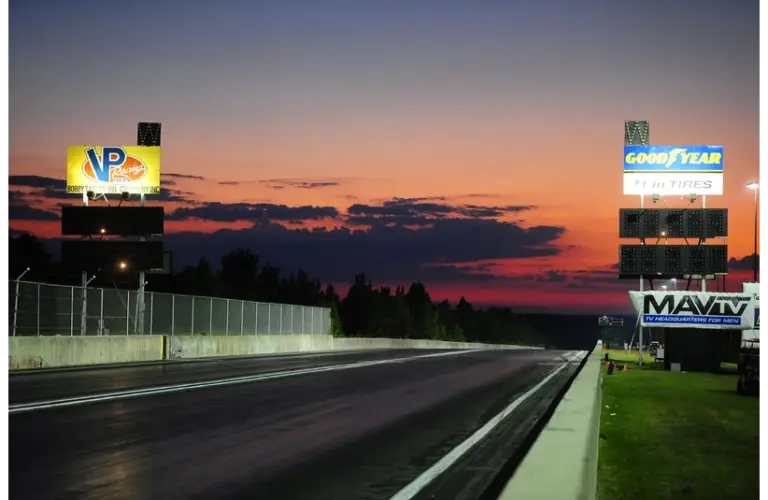 Sept. 10, 2011; Rockingham, NC, USA; Overall view as the sun sets over the ADRL scoreboards during eliminations at Dragstock 8 at Rockingham Dragway. NHRA Nationals