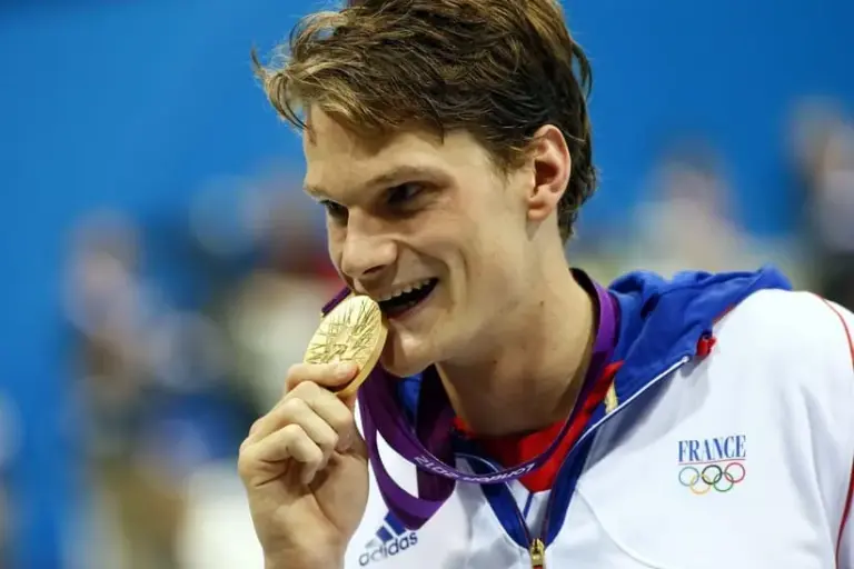 French swimmer Yannick Agnel poses with his gold medal after winning the men's 200-meter freestyle at the 2012 London Olympics. Olympics Swimming Men S 200m Freestyle Finals