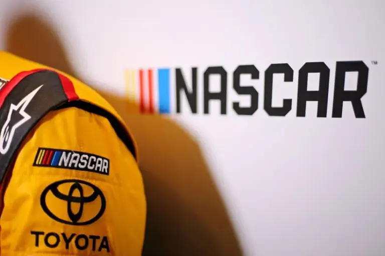 Chase; NASCAR logo and the Toyota logo on the fire suit of NASCAR Cup Series driver Kyle Busch during Daytona 500 media day at Daytona International Speedway.