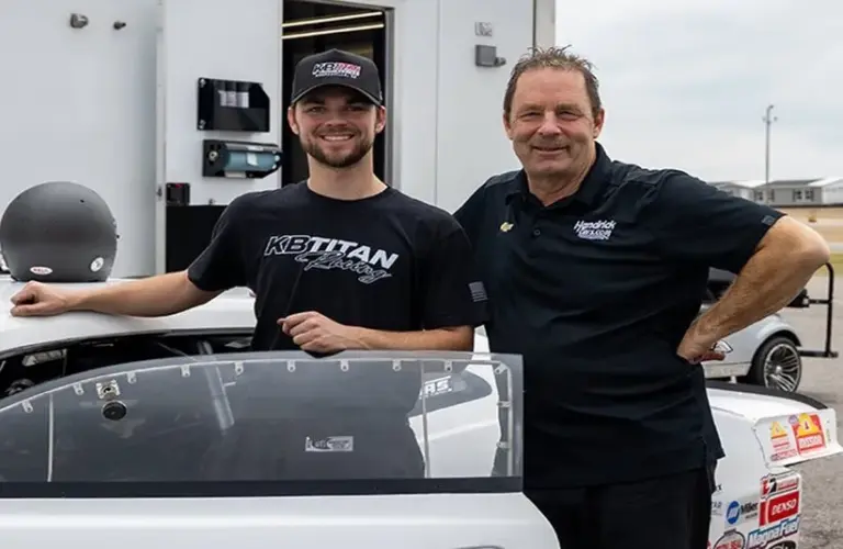 Cody Anderson & Greg Anderson Posing In front of Car
