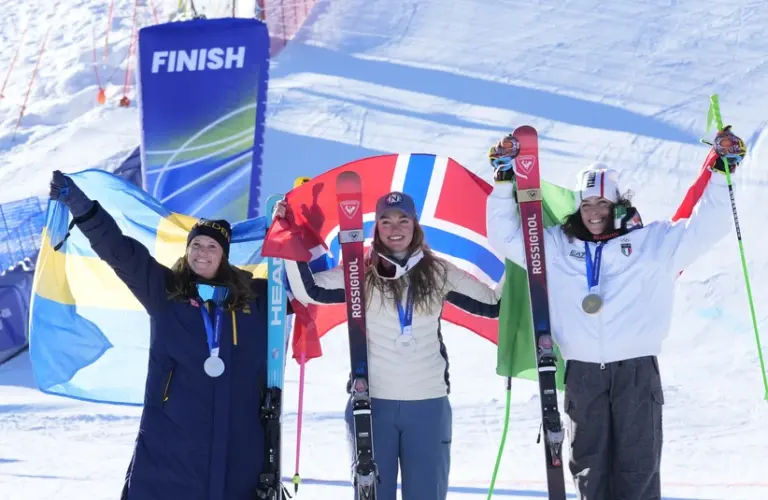 February 15, 2026; Cortina d'Ampezzo, Italy; From left Sara Hector of Sweden, Thea Louise Stjernesund of Norway and Federica Brignone of Italy celebrate on the podium with their medals after the women's alpine skiing giant slalom during the Milano Cortina 2026 Olympic Winter Games.