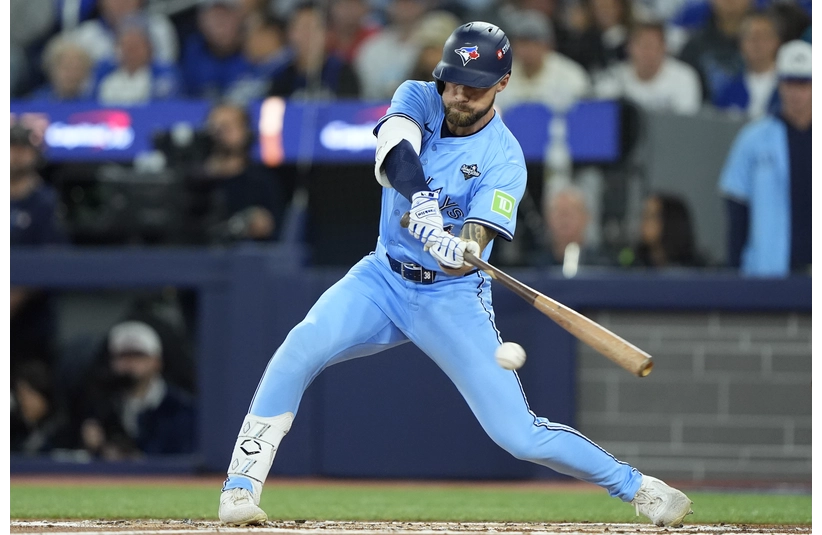 Toronto Blue Jays right fielder Nathan Lukes (38) hits a single against the Los Angeles Dodgers in the first inning during game six of the 2025 MLB World Series at Rogers Centre.