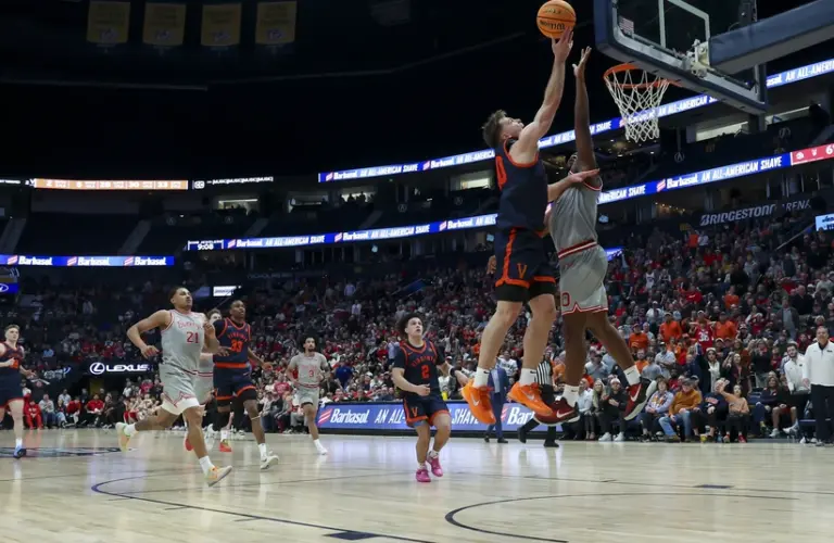 Feb 14, 2026; Nashville, Tennessee, USA; Virginia Cavaliers guard Dallin Hall (30) shoots over Ohio State Buckeyes guard Bruce Thornton (2) during the second half at Bridgestone Arena