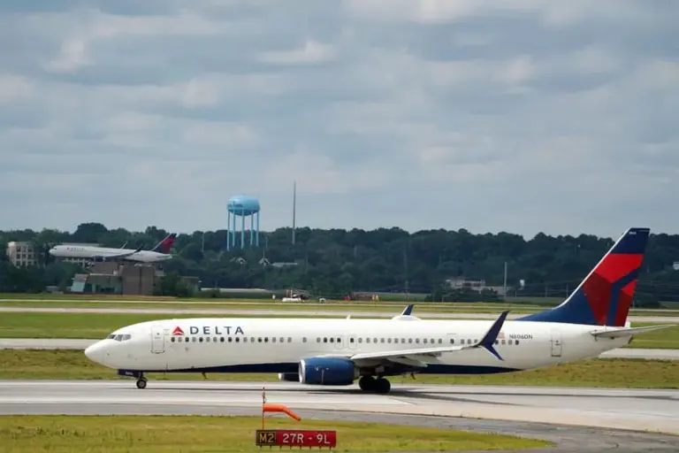 Jun 30, 2022; Atlanta, GA, USA; A Delta 737-900ER Atlanta to Miami flight lines up on the runway during normal operations