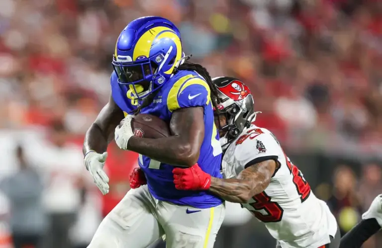 Los Angeles Rams running back Darrell Henderson Jr. tackled by Tampa Bay Buccaneers cornerback Sean Murphy-Bunting