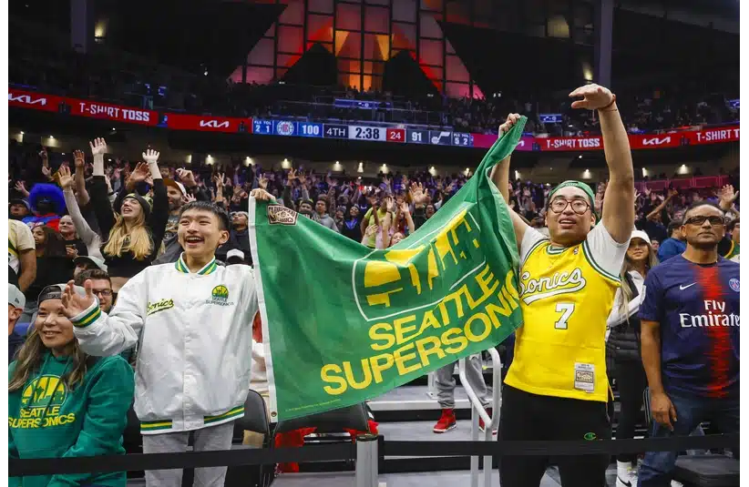 Fans hold a flag for the Seattle Supersonics during the fourth quarter of a game between the Utah Jazz and LA Clippers at Climate Pledge Arena.