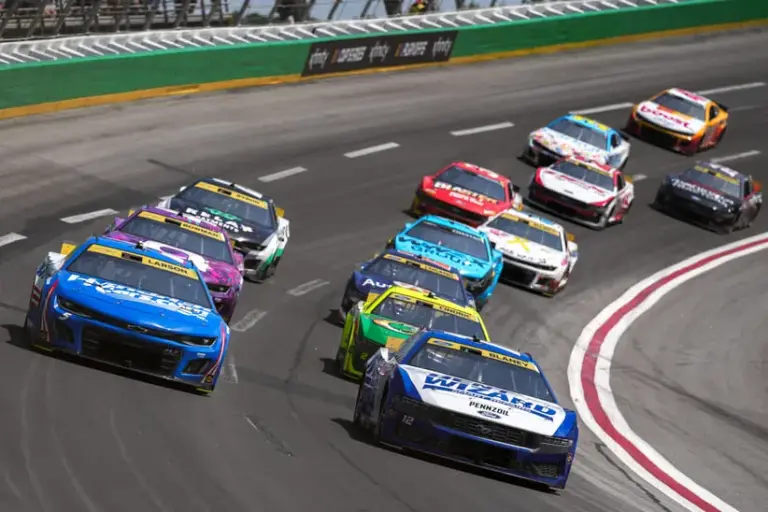Entry List; Sep 8, 2024; Hampton, Georgia, USA; NASCAR Cup Series driver Ryan Blaney (12) leads the pack going into turn four at Atlanta Motor Speedway.