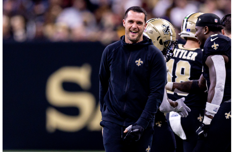 Derek Carr on the sidelines enjoying the game