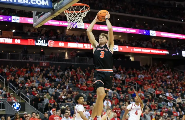 Caden Pierce goes for the dunk in a game.
