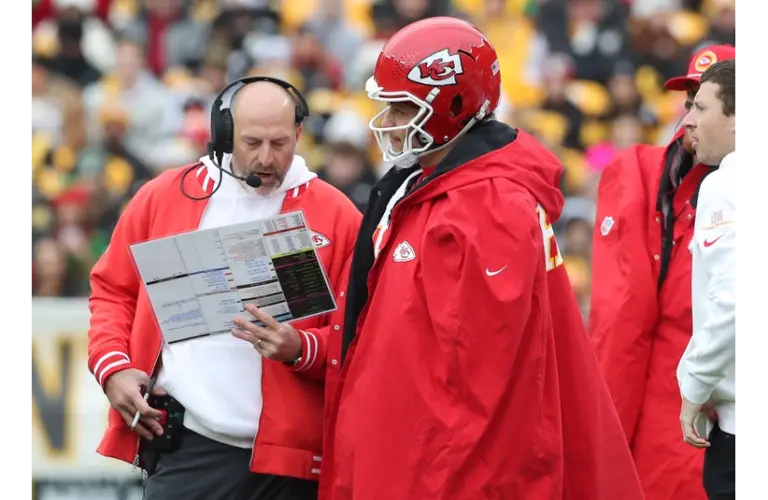 Matt Nagy with Patrick Mahomes going over plays