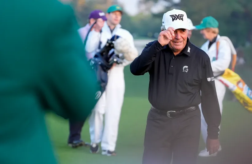 Gary Player tips his hat to the crowd after serving as an honorary start during the first round of the Masters Tournament at Augusta.