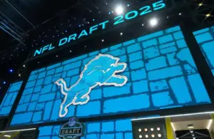 The Detroit Lions logo is projected on the video board, Jack Campbell