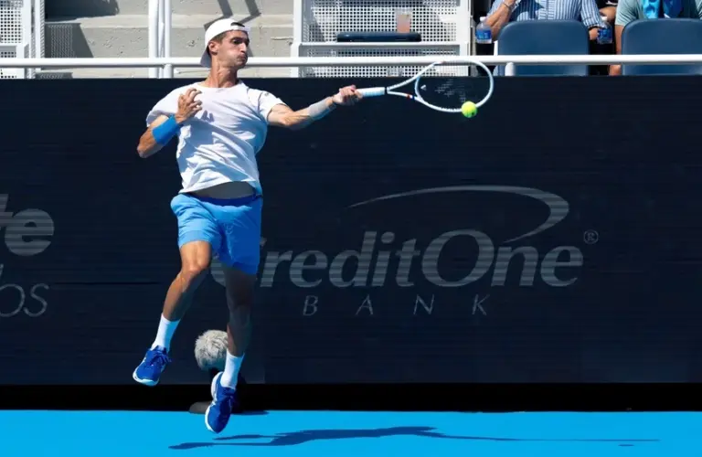 Atmane htting a forehand