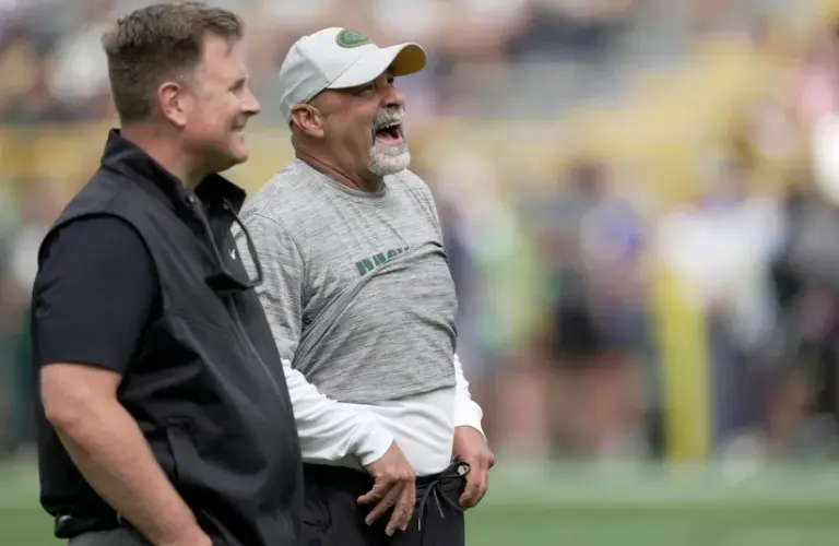 Green Bay Packers general manager Brian Gutekunst, left, talks with assistant head coach/special teams coordinator Rich Bisaccia