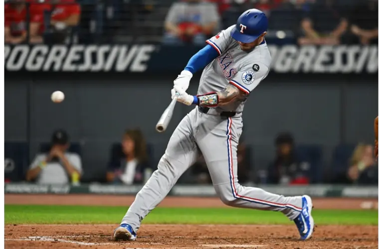Jonah Heim swinging the bat in Cleveland