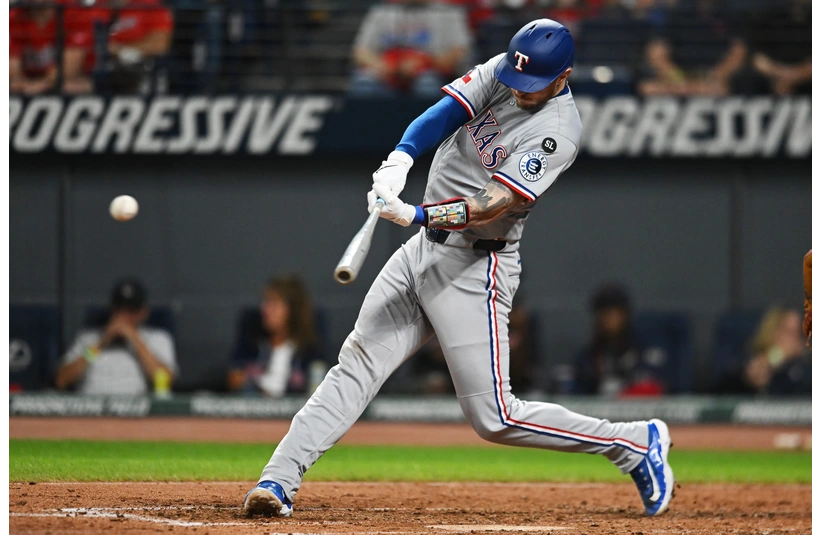 Jonah Heim swinging the bat in Cleveland