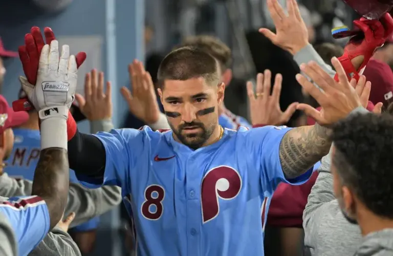 Philadelphia Phillies right fielder Nick Castellanos (8) celebrates after scoring a run during the eighth inning against the Los Angeles Dodgers