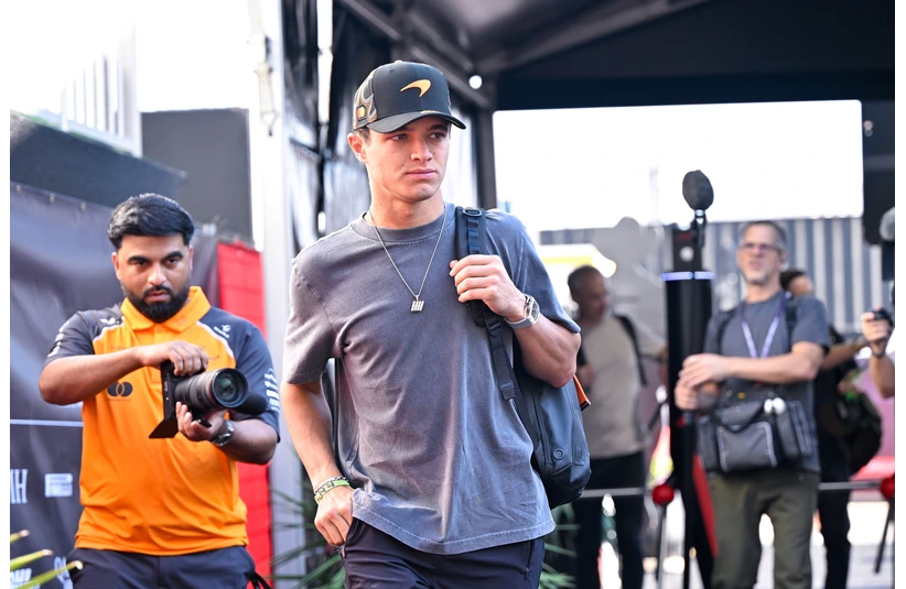 Oct 17, 2025; Austin, TX, USA; McLaren Formula 1 driver Lando Norris (4) of Team Great Britain arrives at the track before practice for the US Grand Prix at Circuit of The Americas Austin. Mandatory Credit: Jerome Miron-Imagn Images