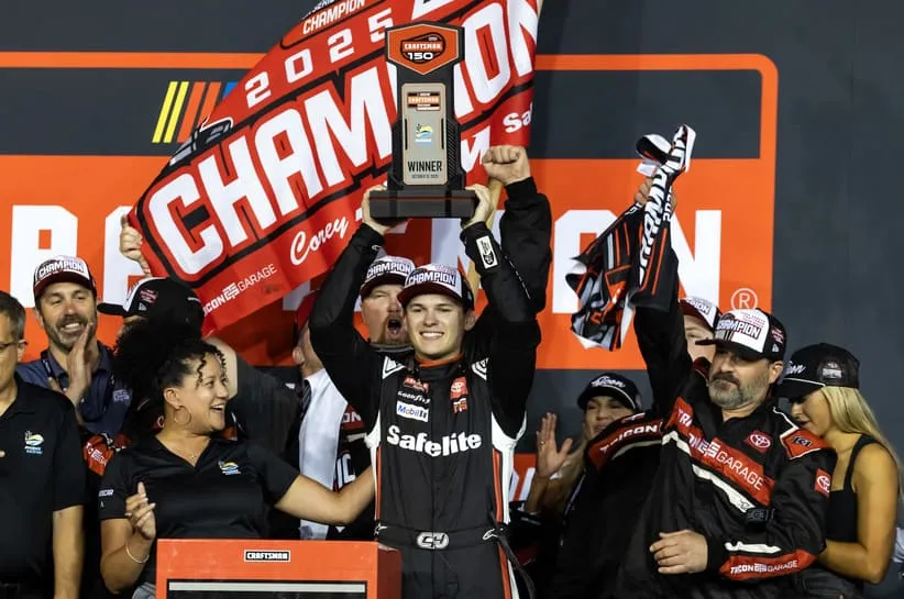Oct 31, 2025; Avondale, Arizona, USA; NASCAR Truck Series driver Corey Heim (11) celebrates after winning the NASCAR Truck Series Championship race and the 2025 Truck Series championship at Phoenix Raceway.