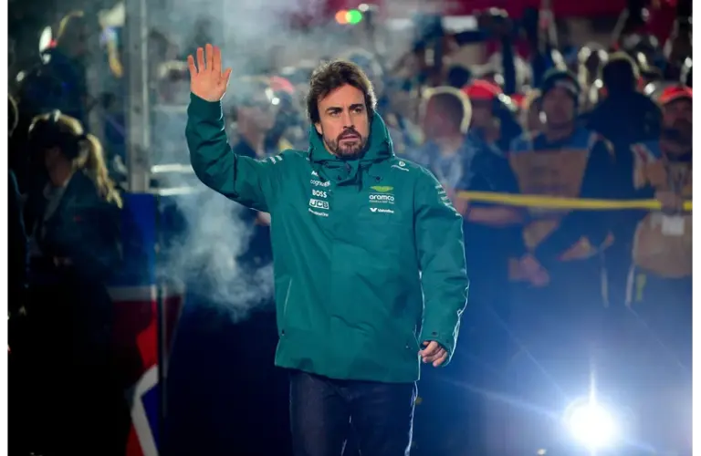Nov 21, 2025; Las Vegas, NV, USA; Aston Martin Racing driver Fernando Alonso (14) is introduced before the Las Vegas Grand Prix at Las Vegas Strip Circuit. Mandatory Credit: Gary A. Vasquez-Imagn Images
