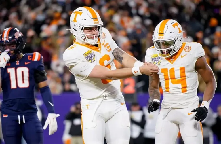Tennessee quarterback Joey Aguilar (6) celebrates his touchdown against Illinois during the first quarter of the Liberty Mutual Music City Bowl