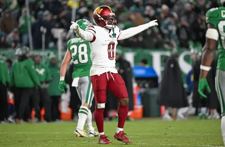 Washington Commanders cornerback Mike Sainristil (0) celebrates