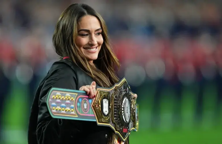 Bella smiling holding her belt