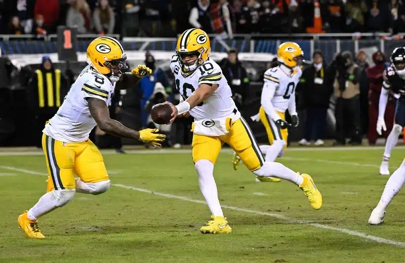 Cuffem watches on Green Bay Packers Josh Jacobs during NFL game