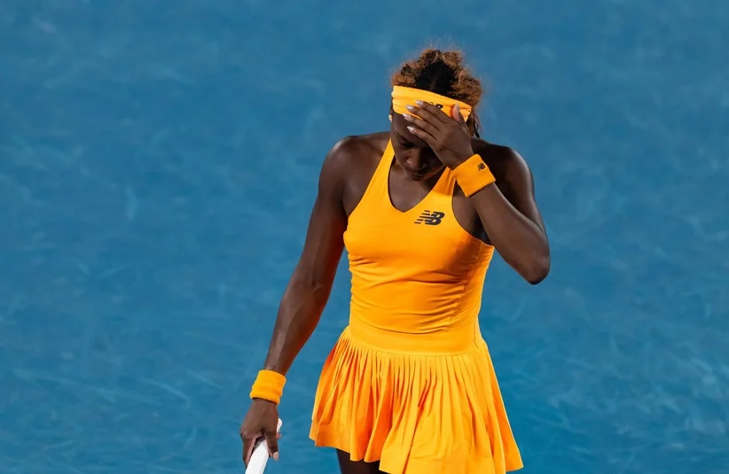 Gauff bowing her head down