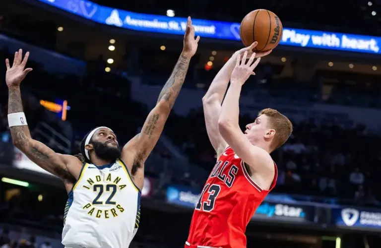 Chicago Bulls guard/forward Kevin Huerter (13) shoots the ball while Indiana Pacers forward Isaiah Jackson (22) defends