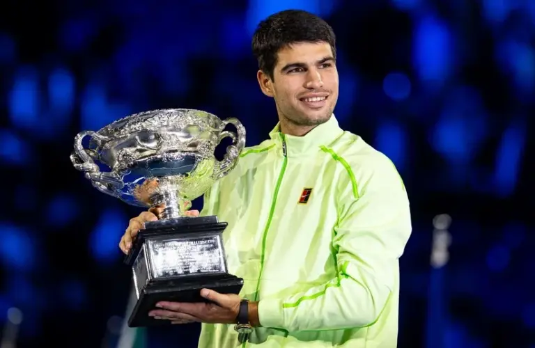 Carlos Alcaraz of Spain with the Norman Brookes Challenge Cup after his victory over Novak Djokovic of Serbia in the final of the menís singles at the Australian Open at Rod Laver Arena in Melbourne Park.