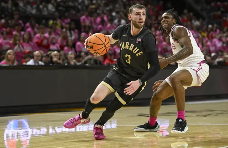 Braden Smith for Purdue driving the ball on a Maryland player.